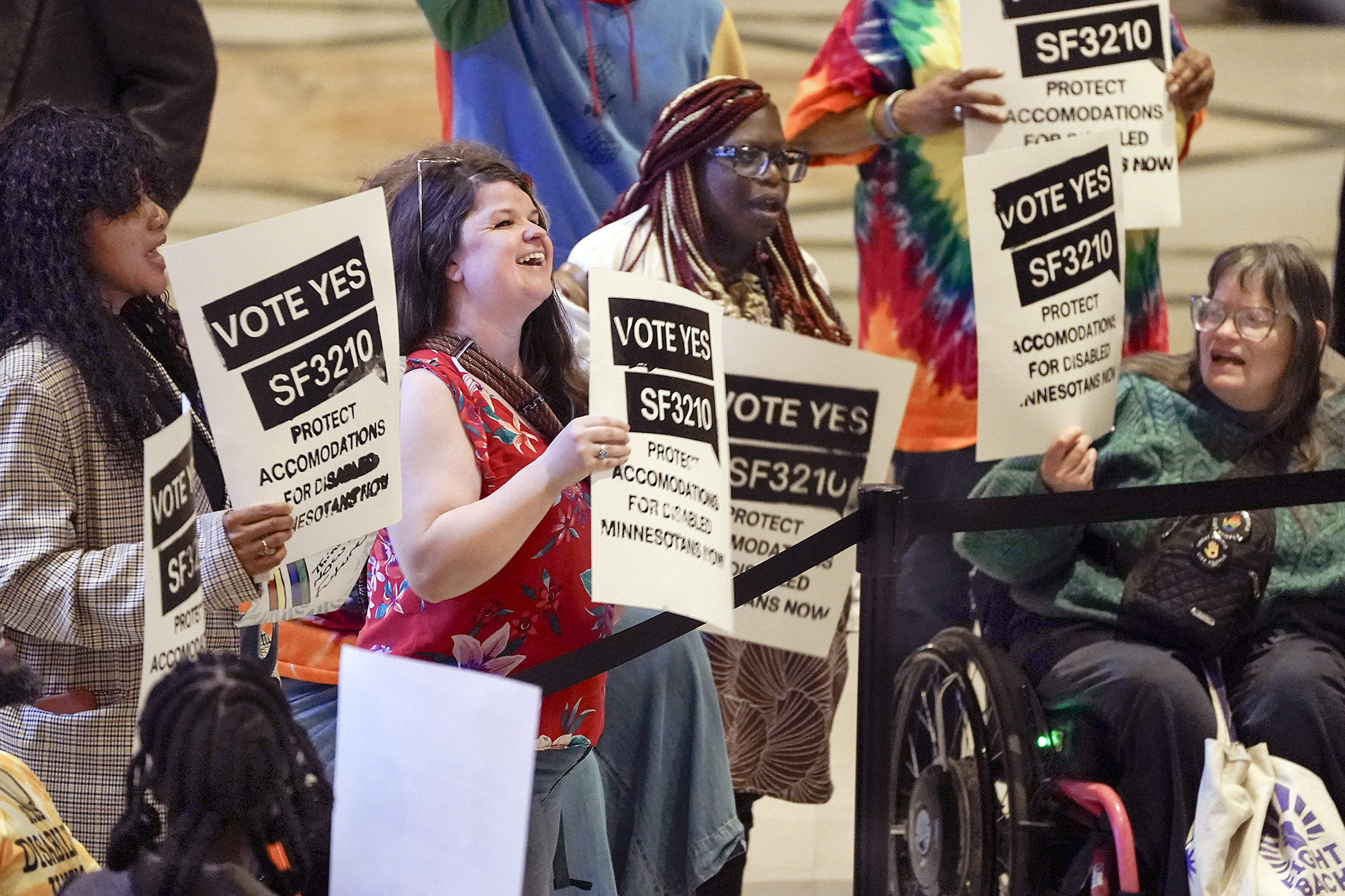 Disability rights activists rally outside the House Chamber during Monday’s floor session. Passed in the House Tuesday, SF3210 would add language to the public policy statement of the state’s Human Rights Act related to accommodations for individuals with a disability. (Photo by Michele Jokinen)